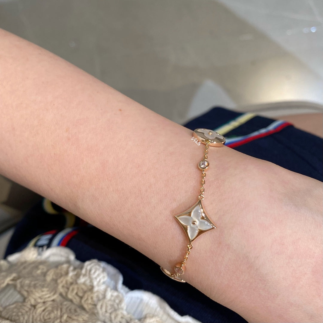 [OAK JURI]STAR AND SUN 4 MOTIF WHITE MOP PINK GOLD BRACELET
